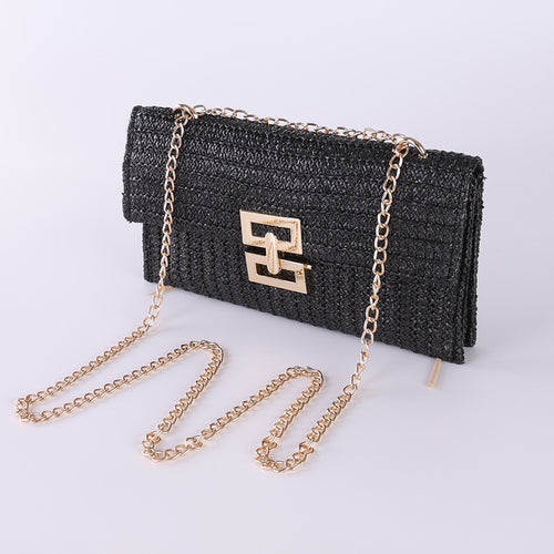 The woven straw design with chain and lock details brings an instant vacation aesthetic to your everyday look.