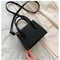 The solid color pattern and crocodile element give this bag a refined, versatile look that pairs with almost any outfit.