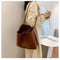 With defined upper width, lower width, and height measurements, this tote maintains a structured, put-together silhouette.
