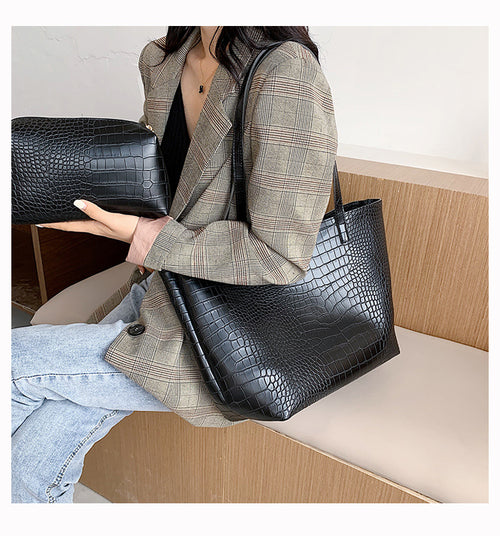 With defined upper width, lower width, and height measurements, this tote maintains a structured, put-together silhouette.